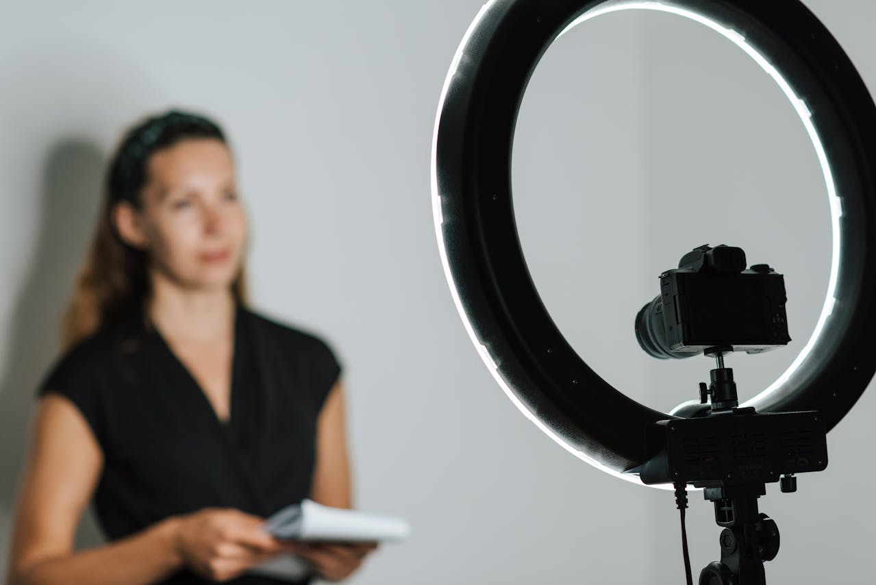 Shooting video of a female model with ring light turned on